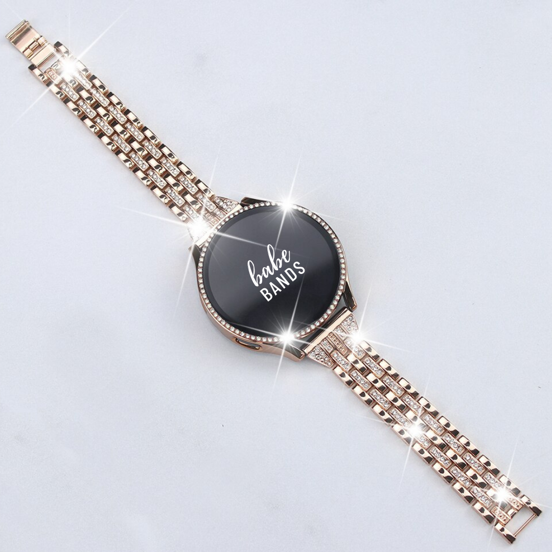No more basic vibes. Step up your babe game with our premium Babe Bands to elevate your style.   Upgrade your Samsung Galaxy Watch with our Premium Crystal Embellished Classic Style Watch Band + Crystal Case Cover Set.  Indulge in the luxury look and feel of our Samsung Galaxy Watch band, crafted from high-quality stainless steel in.a classic style embellished with crystals for a glamorous touch.