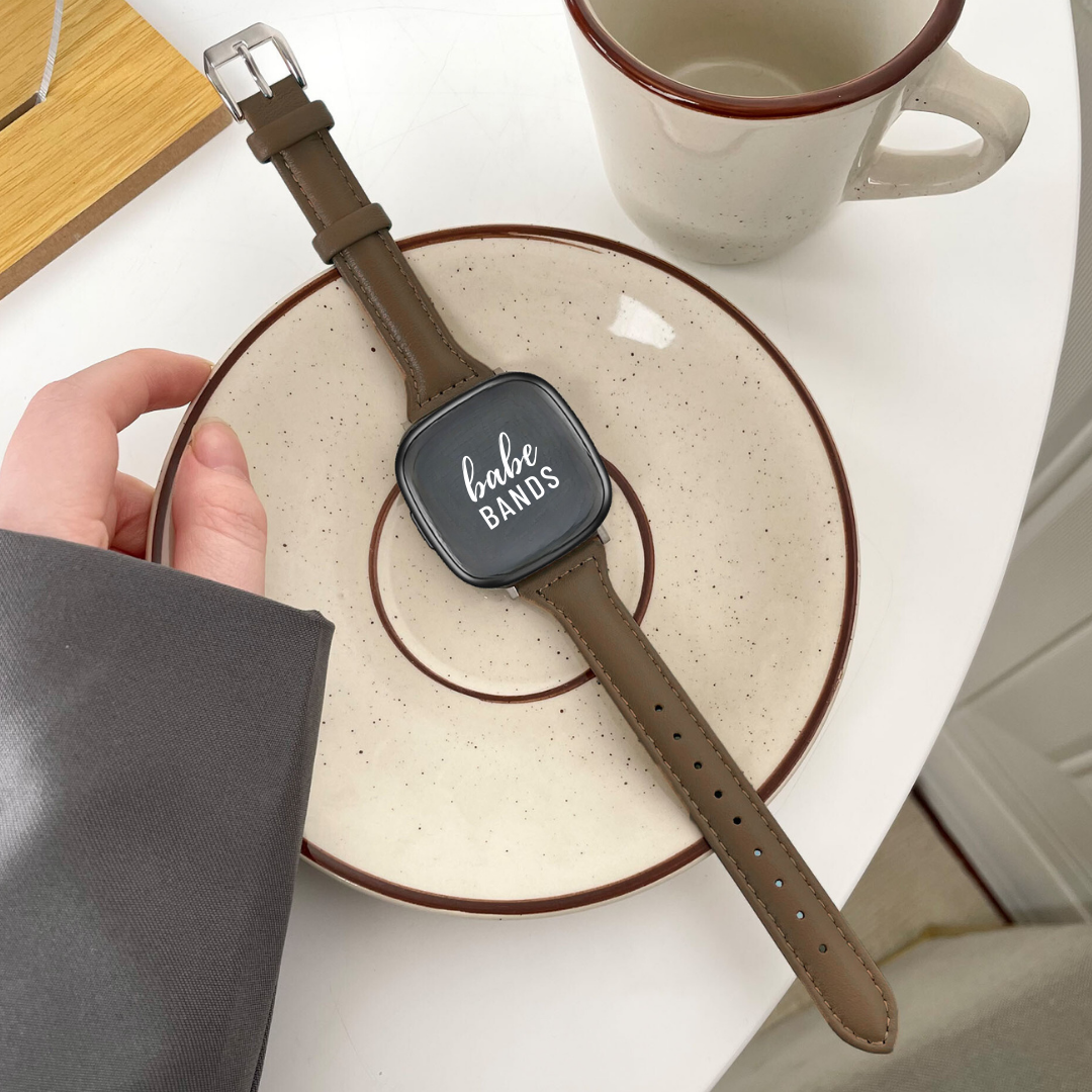 No more basic vibes. Step up your babe game with our premium Babe Bands to elevate your style.    Upgrade your Fitbit Versa or Fitbit Sense with our Premium Genuine Leather Slim Fitbit Versa/Sense Watch Band.  Indulge in the luxury look and feel of our Fitbit band, crafted from high-quality genuine leather with a stainless steel classic buckle closure.