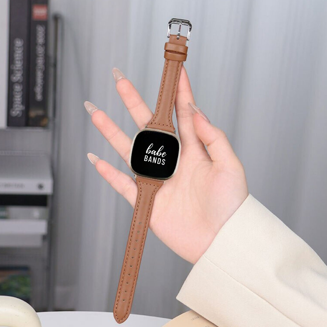 No more basic vibes. Step up your babe game with our premium Babe Bands to elevate your style.    Upgrade your Fitbit Versa or Fitbit Sense with our Premium Genuine Leather Slim Fitbit Versa/Sense Watch Band.  Indulge in the luxury look and feel of our Fitbit band, crafted from high-quality genuine leather with a stainless steel classic buckle closure.