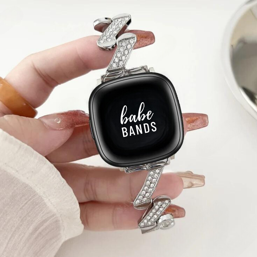 No more basic vibes. Step up your babe game with our premium Babe Bands to elevate your style.   Upgrade your Fitbit Versa or Fitbit Sense with our Premium Stainless Steel Diamond Zig Zag Fitbit Versa/Sense Band.  Indulge in the luxury look and feel of our Fitbit band, crafted from high-quality stainless steel band in a unique zig zag shape embellished with sparkling rhinestones for added style.