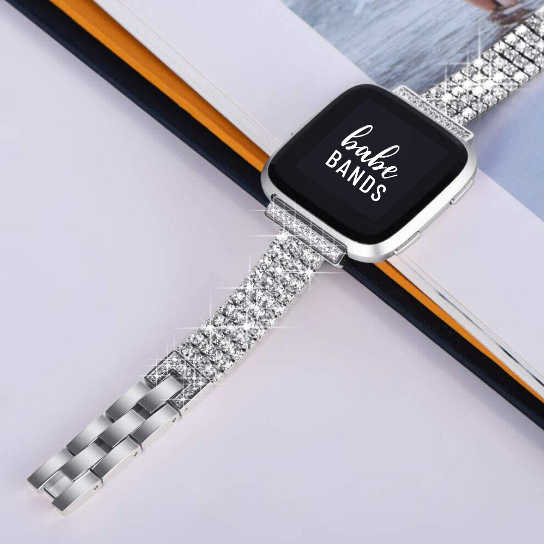 No more basic vibes. Step up your babe game with our premium Babe Band to elevate your Apple Watch style.      Upgrade your Fitbit Versa with our Premium Stainless Steel Full Rhinestone Fitbit Versa Band.  Indulge in the luxury look of our Fitbit Vera band, crafted from high-quality materials including a stainless steel band fully embellished with faux diamonds.