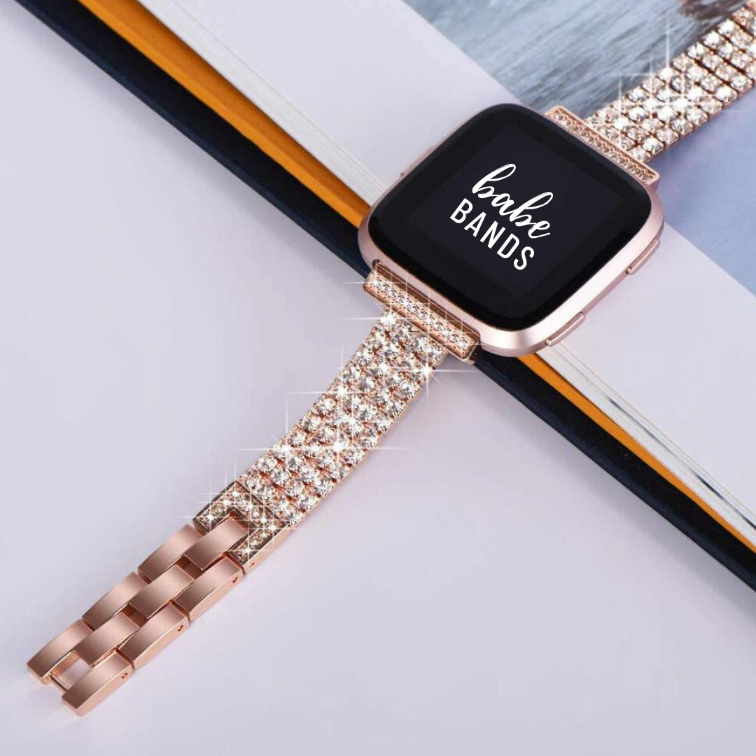 No more basic vibes. Step up your babe game with our premium Babe Band to elevate your Apple Watch style.      Upgrade your Fitbit Versa with our Premium Stainless Steel Full Rhinestone Fitbit Versa Band.  Indulge in the luxury look of our Fitbit Vera band, crafted from high-quality materials including a stainless steel band fully embellished with faux diamonds.
