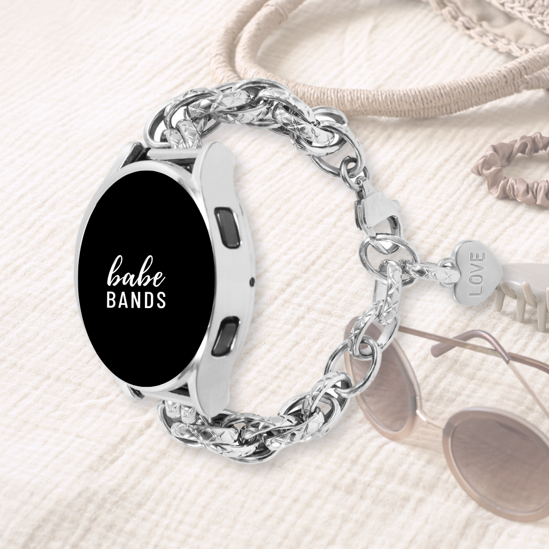 No more basic vibes. Step up your babe game with our premium Babe Bands to elevate your style.    Upgrade your Samsung Galaxy Watch with our Premium Stainless Steel Textured Double Chain Link Samsung Galaxy Watch Band.  Indulge in the luxury look and feel of our Samsung Galaxy Watch band, crafted from high-quality stainless steel in an elegant chain link style with textured chain detailing and a heart shaped "Love" pendant for added style.