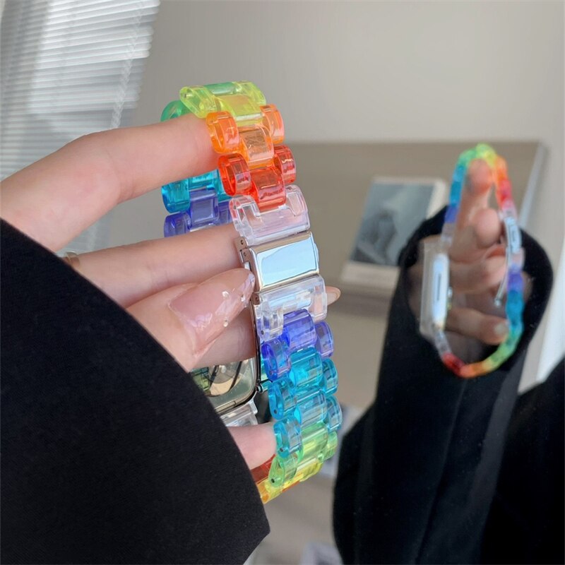 No more basic vibes. Step up your babe game with our premium Babe Bands to elevate your style.   Upgrade your Apple Watch with our Premium Resin Clear Rainbow Classic Link Style Apple Watch Band.  Indulge in the luxury look and feel of our Apple Watch band, crafted from high-quality clear rainbow colored resin in a classic watch band style.